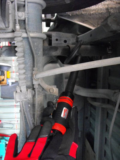 a close up of a wrench on the front of a vehicle