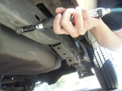 a close up of a person working on a vehicle