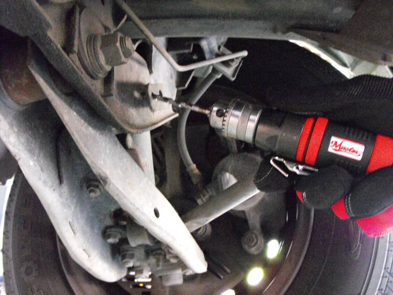 a close up of a person working on a vehicle